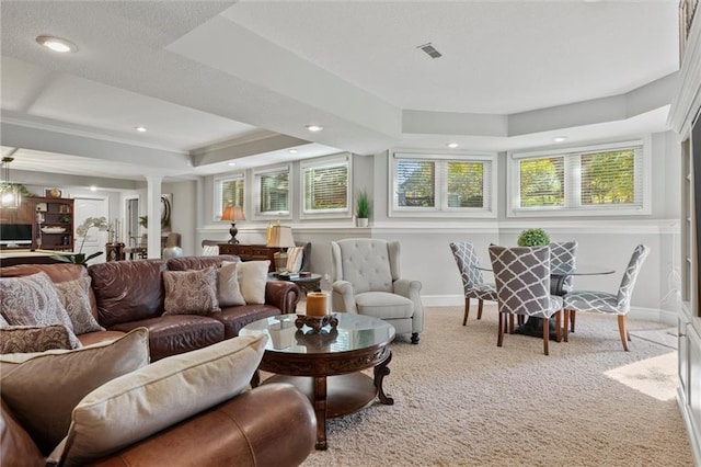 sunroom / solarium with decorative columns and a tray ceiling