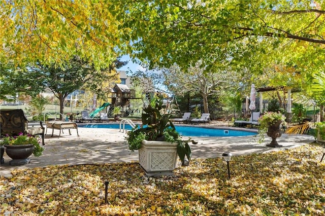 view of swimming pool with a patio area