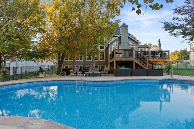 view of swimming pool featuring a deck