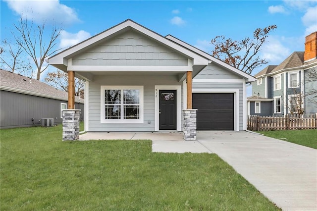 view of front facade featuring covered porch, central AC unit, a front lawn, and a garage