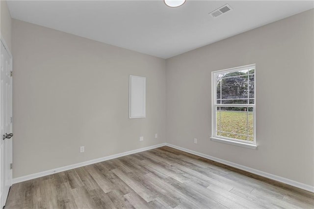 empty room with light hardwood / wood-style floors