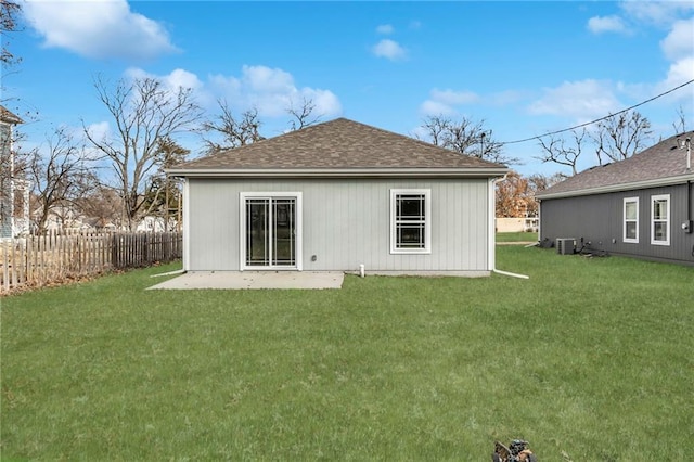 rear view of house with a lawn and a patio area