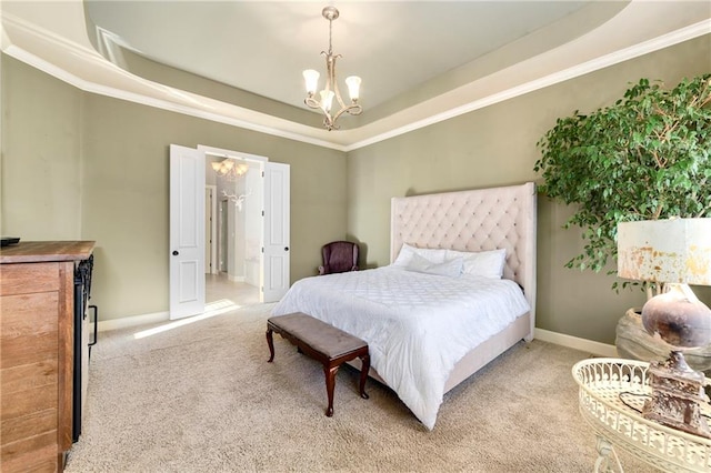 bedroom featuring a raised ceiling, crown molding, carpet flooring, and a chandelier