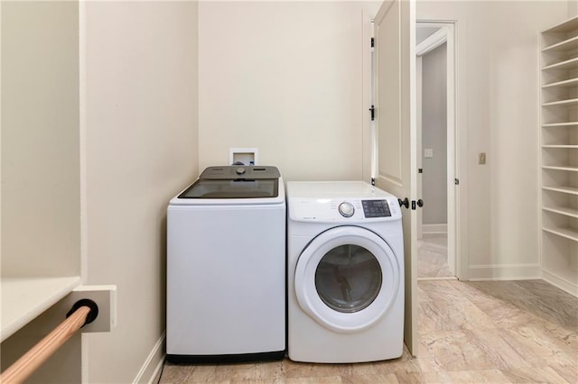 washroom with washer and dryer