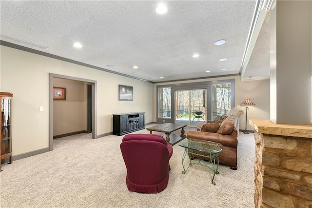 carpeted living room with a textured ceiling and ornamental molding