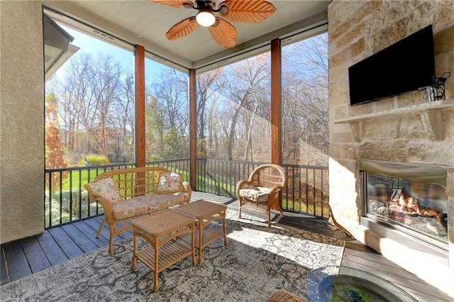 sunroom featuring plenty of natural light and ceiling fan