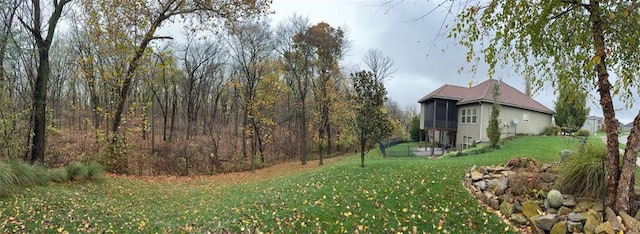 view of yard with a sunroom