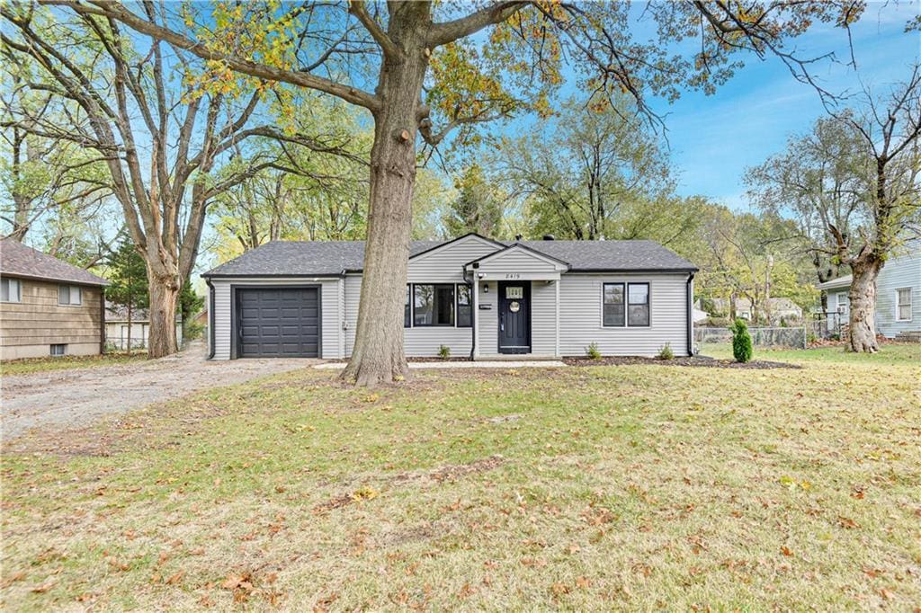 8419 Blue Ridge Blvd, Raytown, MO 64138 - ranch-style house with a garage and driveway