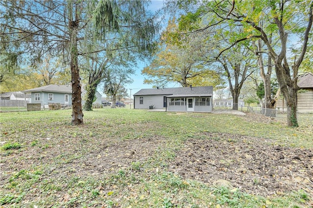 view of yard with a sunroom