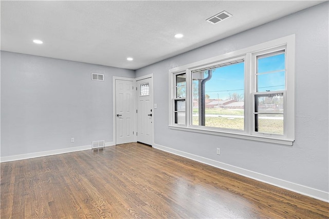 foyer entrance featuring dark hardwood / wood-style flooring