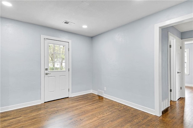 foyer with dark hardwood / wood-style flooring