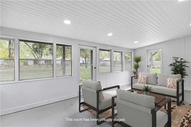 sunroom / solarium featuring a wealth of natural light and wooden ceiling