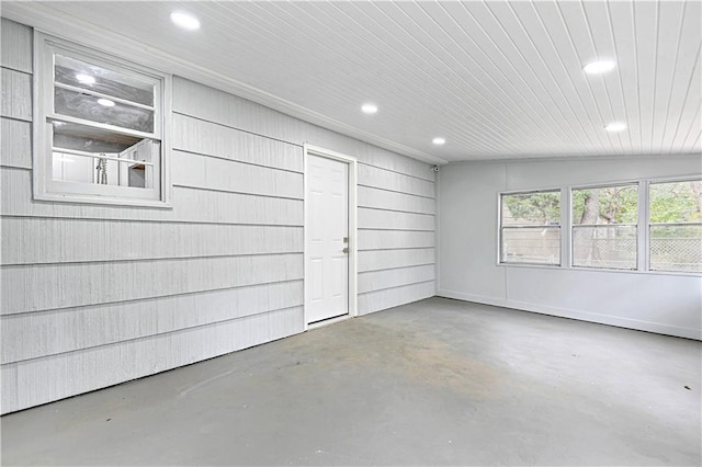 interior space featuring wooden walls