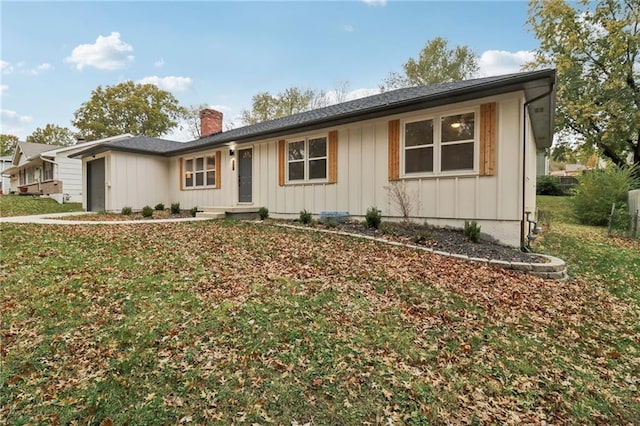 ranch-style house with a front lawn