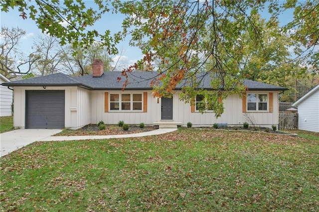 ranch-style house with a garage and a front lawn