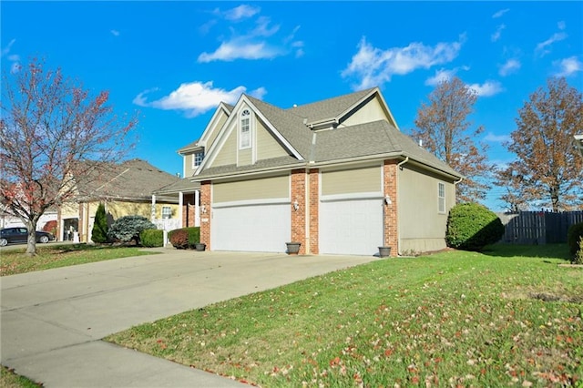 view of front of home featuring a front yard and a garage