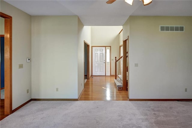 entryway with ceiling fan and light wood-type flooring