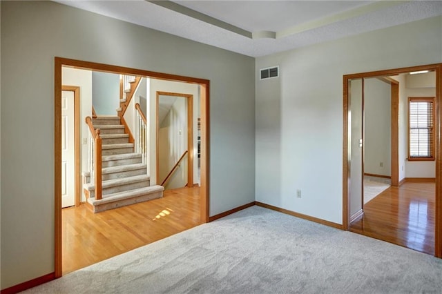 empty room with hardwood / wood-style flooring