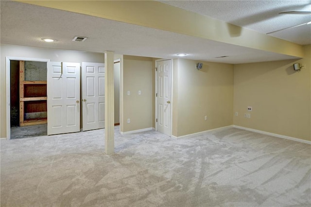 basement featuring light carpet