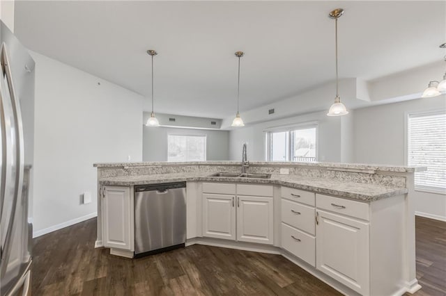 kitchen featuring dark hardwood / wood-style floors, white cabinetry, sink, and appliances with stainless steel finishes