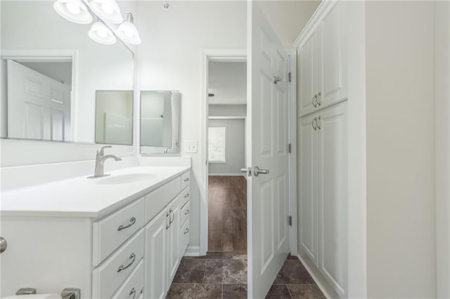 bathroom featuring hardwood / wood-style floors and vanity