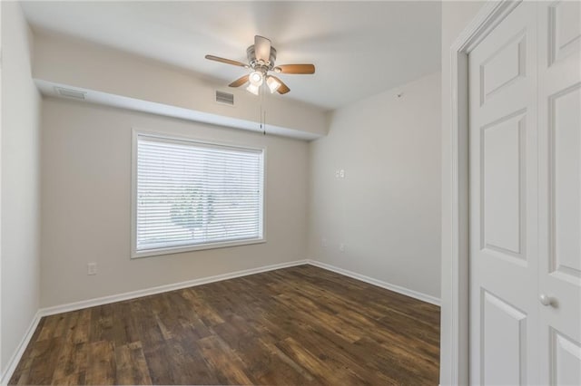 unfurnished room featuring dark hardwood / wood-style flooring and ceiling fan