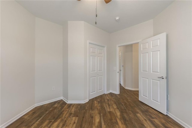 spare room featuring dark wood-type flooring