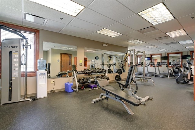 workout area featuring a drop ceiling