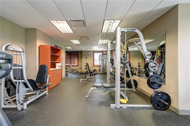 workout area featuring a drop ceiling