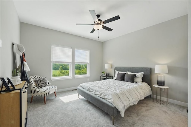1024 Branchwood Ln, Raymore, MO 64083 - carpeted bedroom featuring baseboards and a ceiling fan