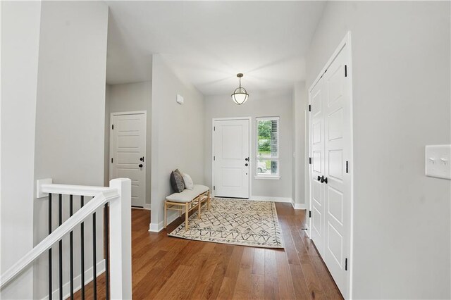 1024 Branchwood Ln, Raymore, MO 64083 - entryway featuring dark wood-type flooring and baseboards