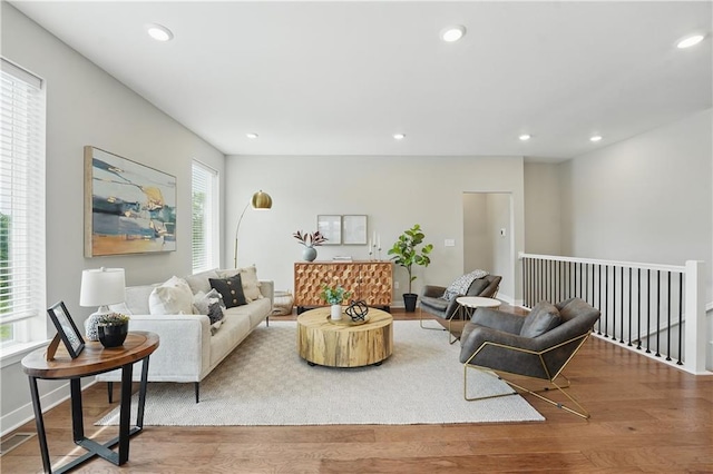 1024 Branchwood Ln, Raymore, MO 64083 - living room with healthy amount of natural light, wood finished floors, and recessed lighting
