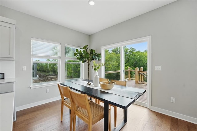 1024 Branchwood Ln, Raymore, MO 64083 - dining area with light wood-style flooring
