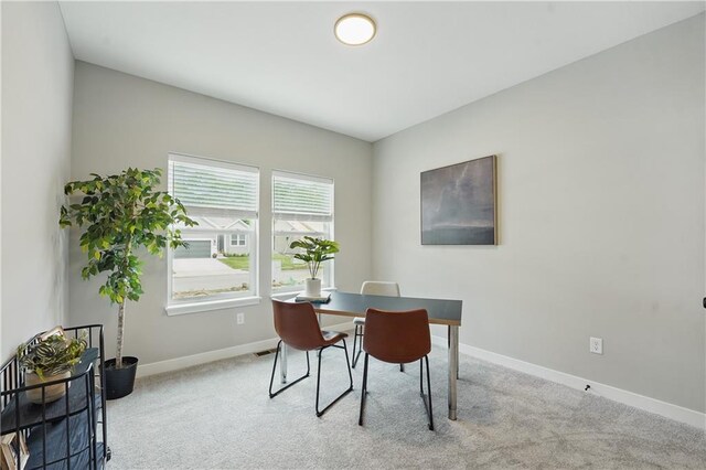 1024 Branchwood Ln, Raymore, MO 64083 - dining area with baseboards and light carpet