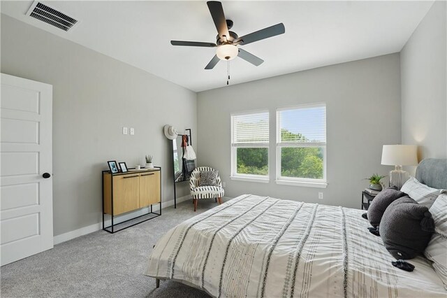 1024 Branchwood Ln, Raymore, MO 64083 - bedroom featuring light carpet and ceiling fan