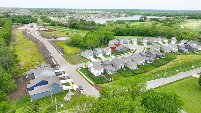 1024 Branchwood Ln, Raymore, MO 64083 - aerial view of property and surrounding area featuring a nearby body of water and nearby suburban area