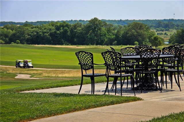 1024 Branchwood Ln, Raymore, MO 64083 - surrounding community with a yard and view of golf course