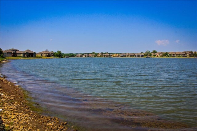1024 Branchwood Ln, Raymore, MO 64083 - water view with nearby suburban area