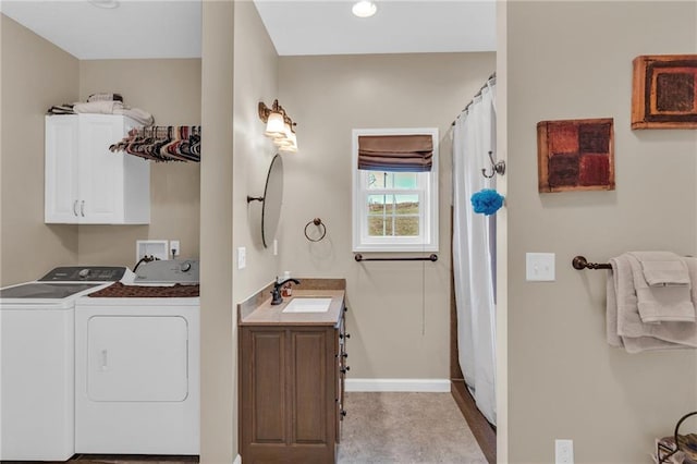 bathroom with vanity and independent washer and dryer