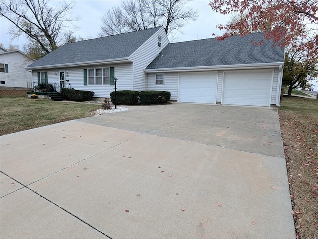 view of front of home featuring a front lawn and a garage