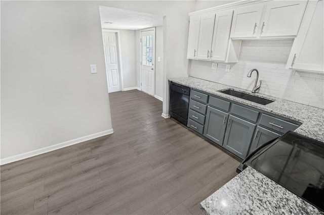 kitchen with black appliances, white cabinetry, dark wood-type flooring, and sink