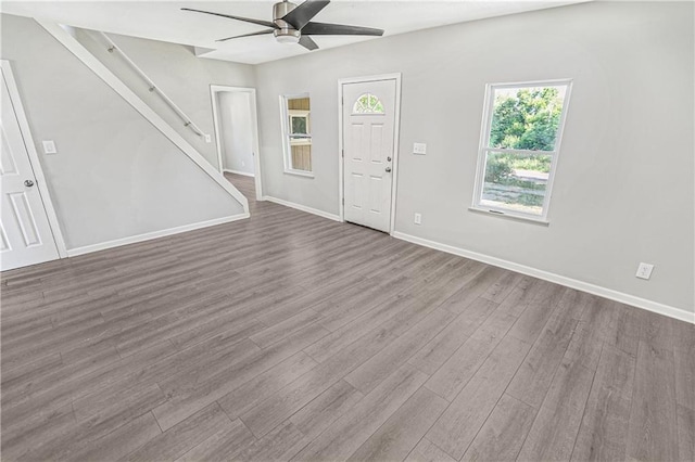112 W Pine St, Drexel, MO 64742 - unfurnished living room with a ceiling fan, wood finished floors, baseboards, and stairs