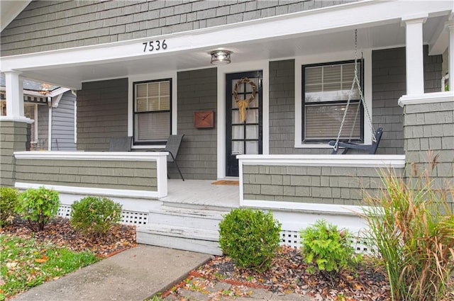 entrance to property with covered porch