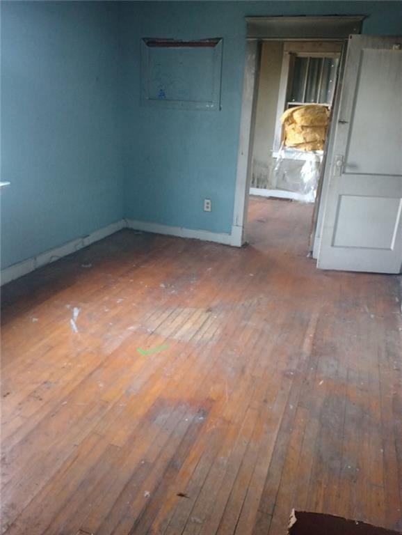 unfurnished room featuring wood-type flooring