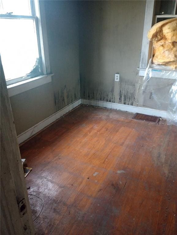 spare room featuring hardwood / wood-style flooring