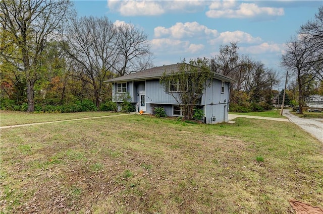 split foyer home with a front lawn