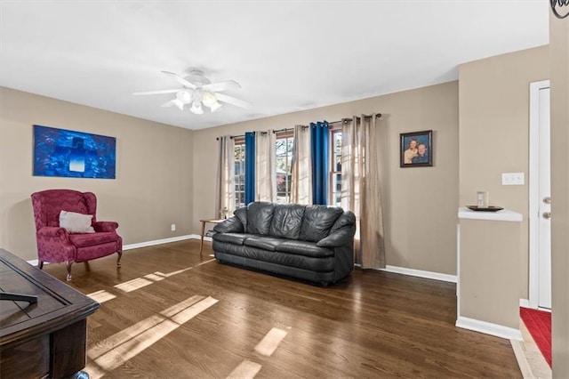 living room with ceiling fan and dark hardwood / wood-style floors