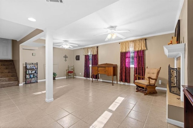 living area featuring ceiling fan, light tile patterned floors, and crown molding