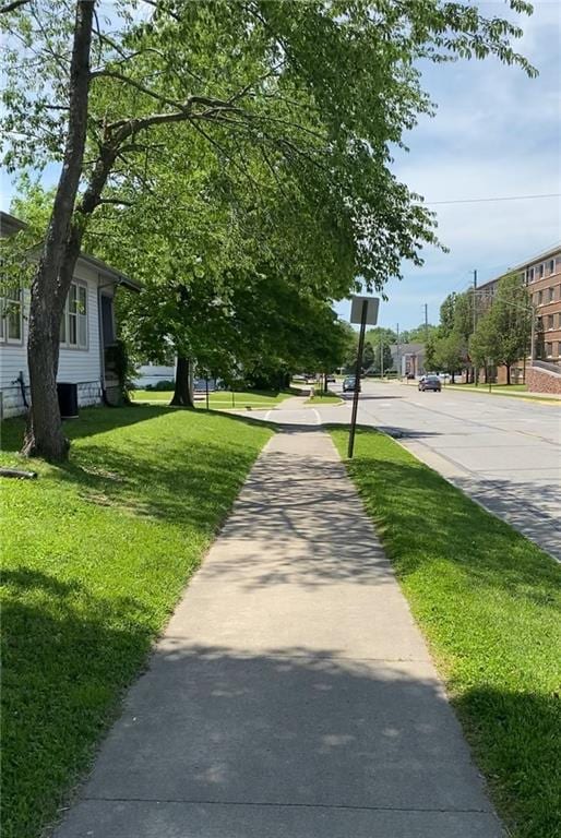 view of community featuring a yard