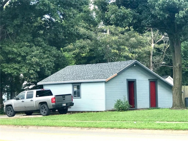 view of home's exterior with a yard